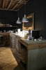 rustic-industrial-kitchen-with-black-walls-concrete-counters.jpg
